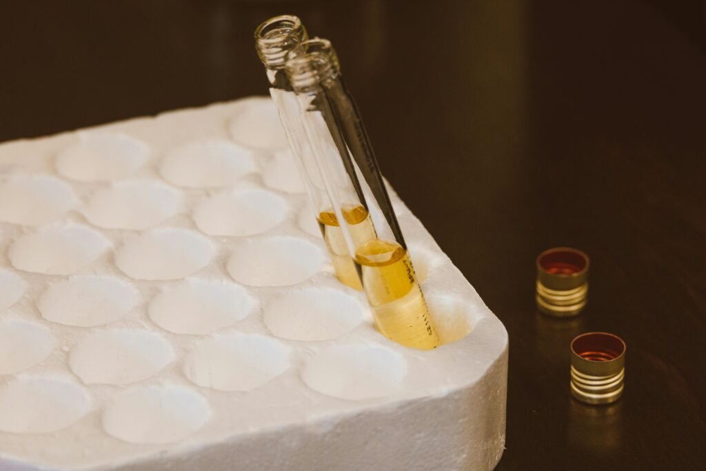 Close-up of test tubes with liquid in a styrofoam holder, perfect for scientific experiment visuals.